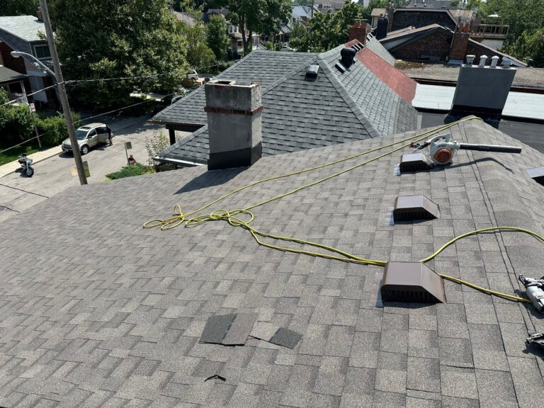 new asphalt shingle roof installed with vents after roof replacement in Toronto