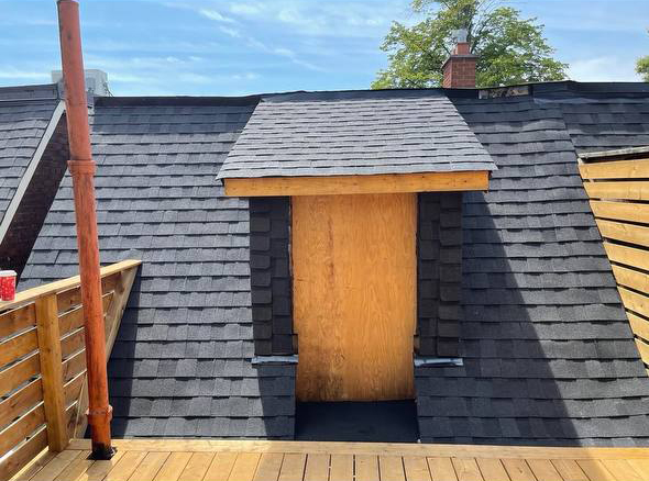 roof replacement before showing damaged shingles around dormer in Toronto