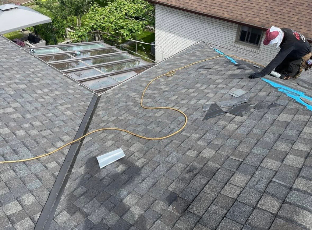 emergency roof repair in Toronto fixing shingles near skylight