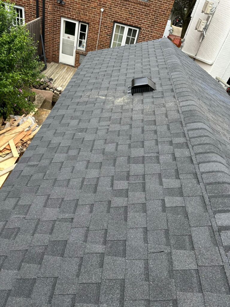 emergency roof repair in Toronto fixing damaged shingles