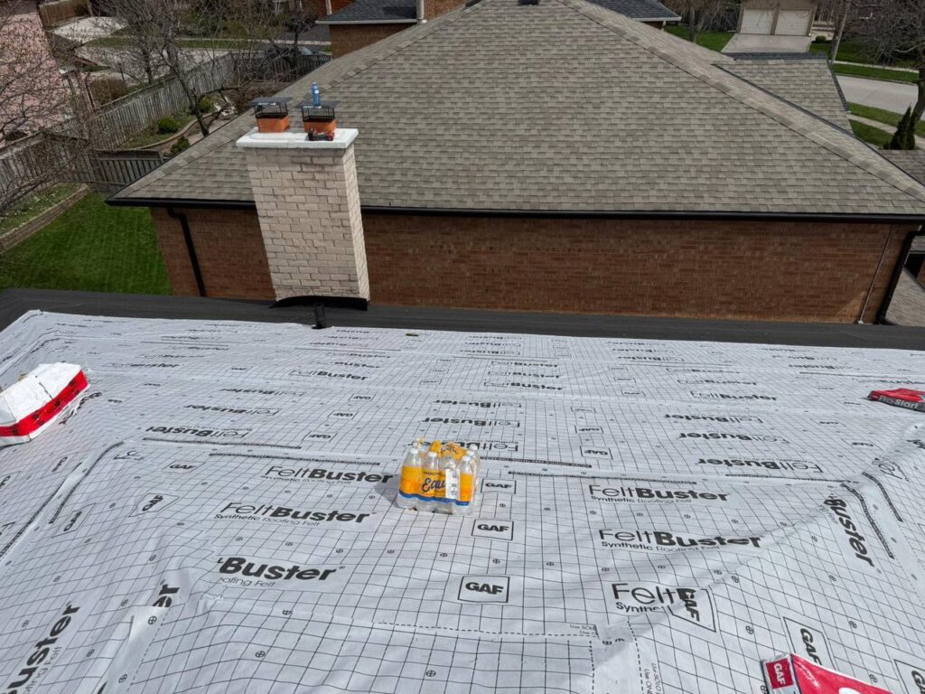Roof before repair service in North York showing damaged shingles and roofing preparation