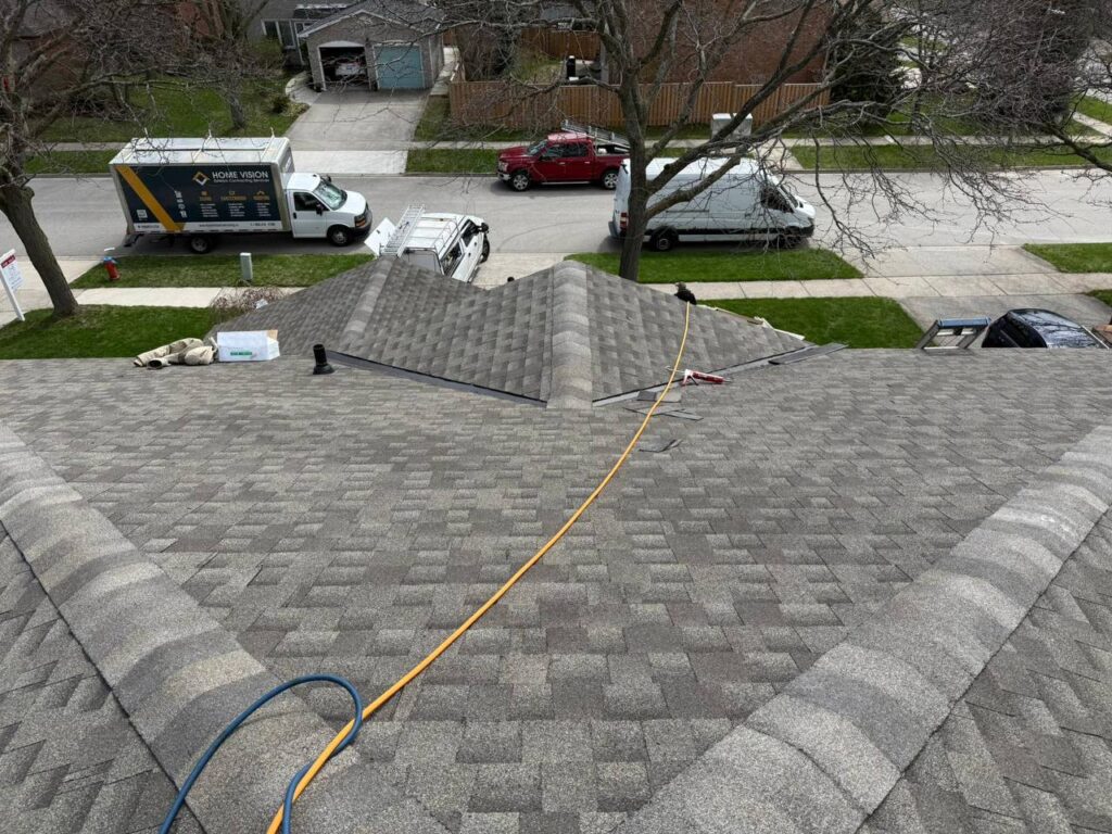 Completed roof repair project in North York with new shingles and finished roofing system