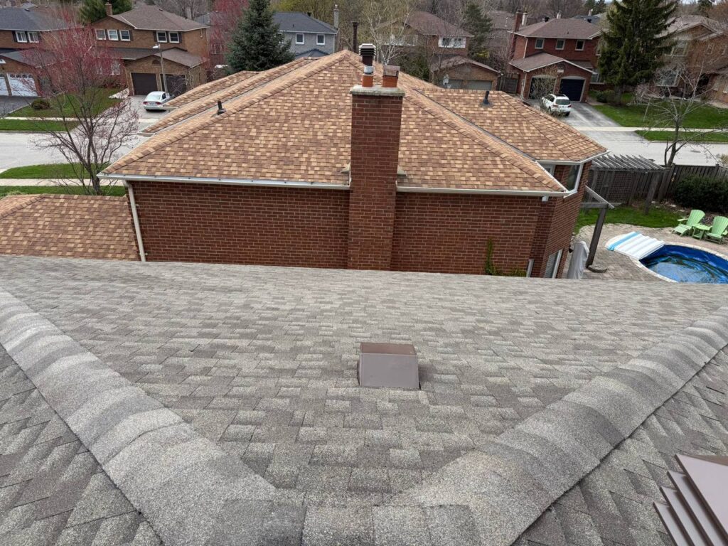 Completed roof repair project in North York with finished shingles and fully protected roofing system