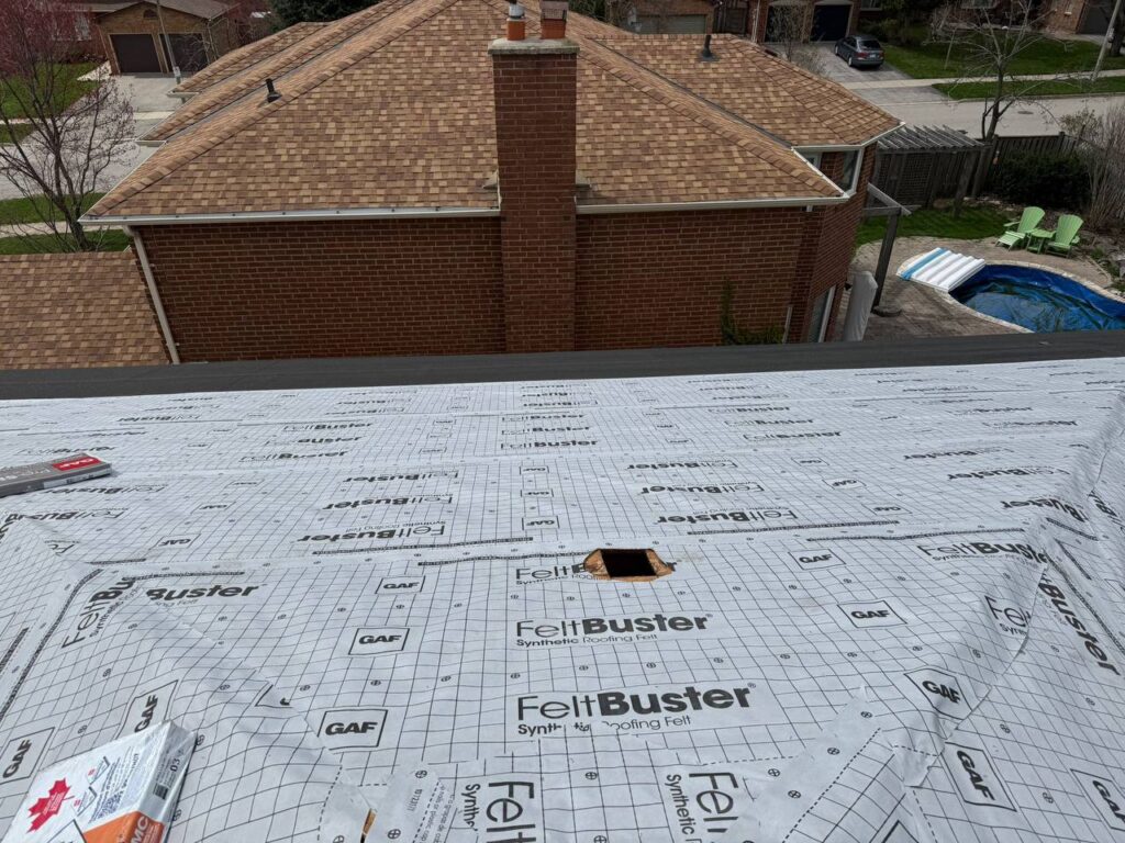 Roof repair project in North York showing waterproof underlayment installed before final roofing completion
