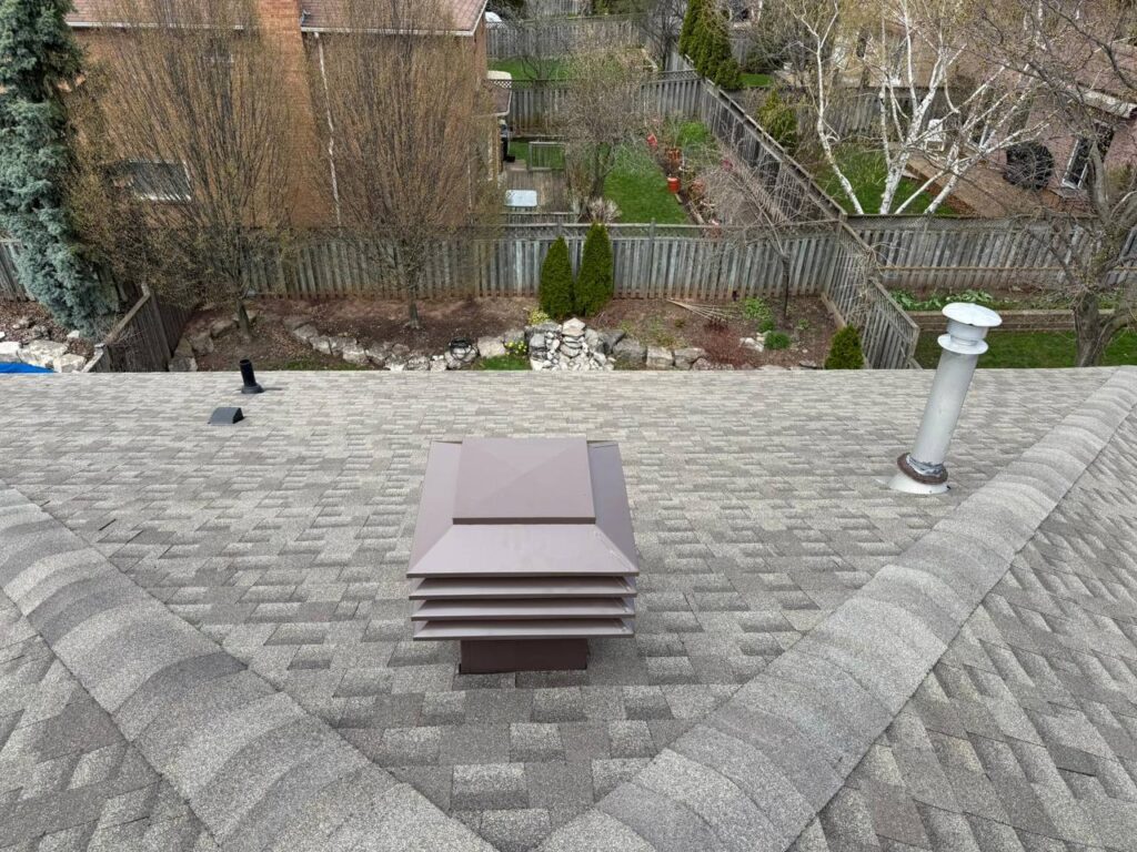 Completed roof repair project in North York with protective roofing membrane installed around skylight area