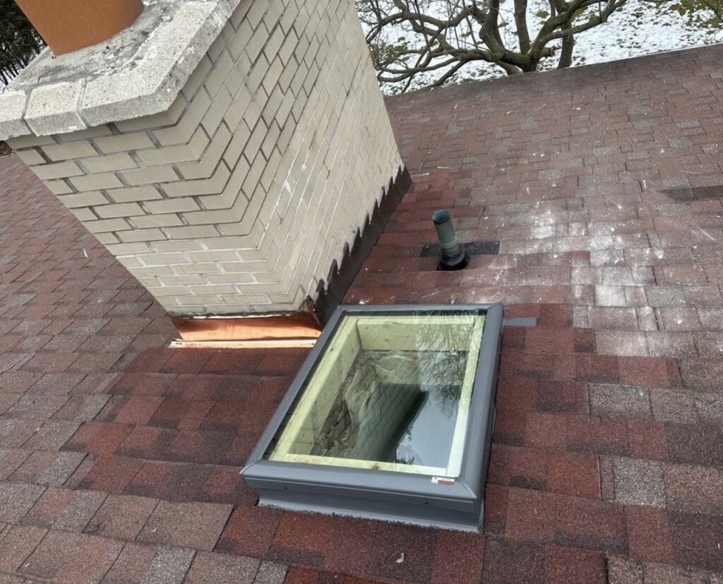 roof repair in Toronto around chimney and skylight flashing