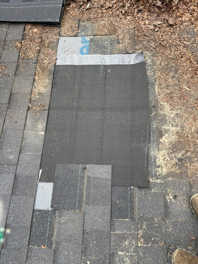 Installing roof underlayment in Toronto during roof repair process