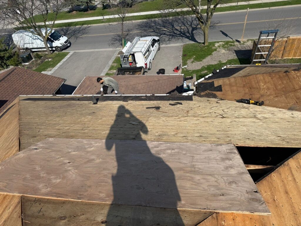 Roof replacement in progress in North York with new plywood decking and waterproof underlayment installation by Expert Roofers LTD.