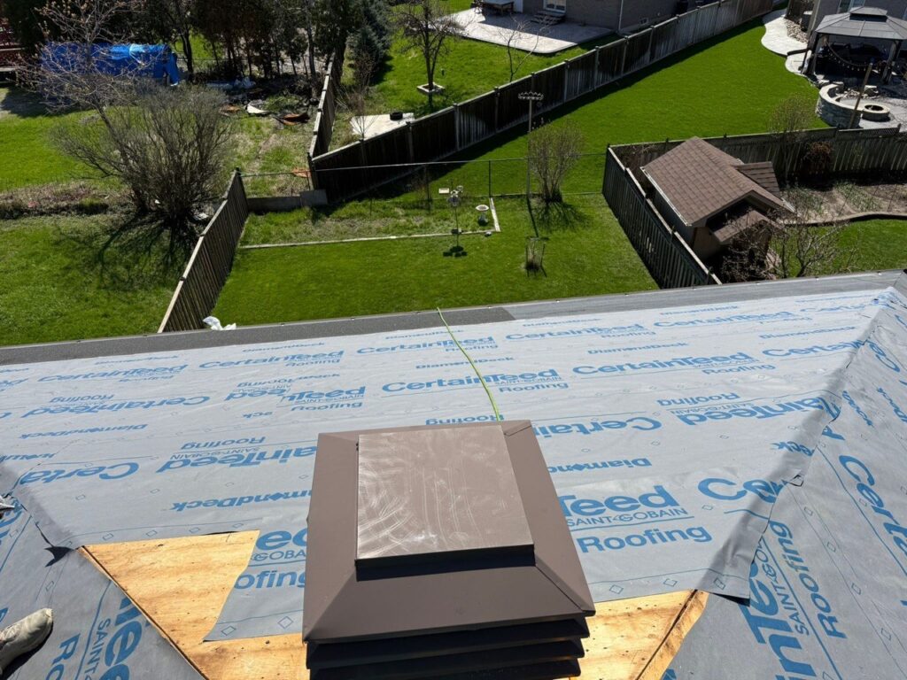 Old roof area in North York before roof vent installation, showing roof deck preparation and old vent removal.