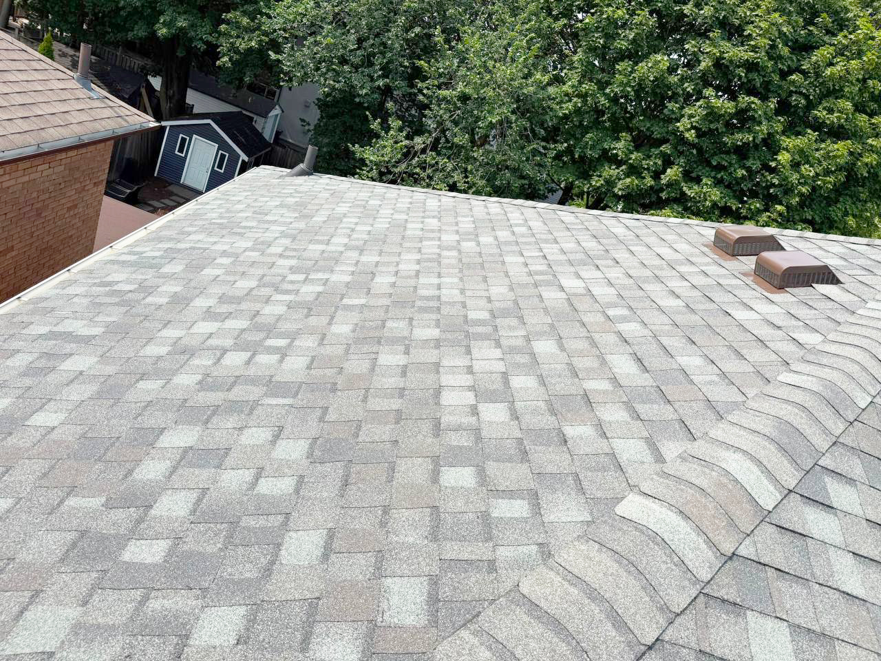 Completed asphalt shingle roof repair with new shingles installed in Markham.