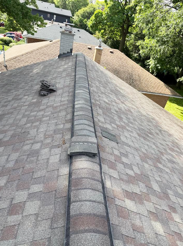 Damaged ridge shingles requiring professional roof leak repair in Markham.