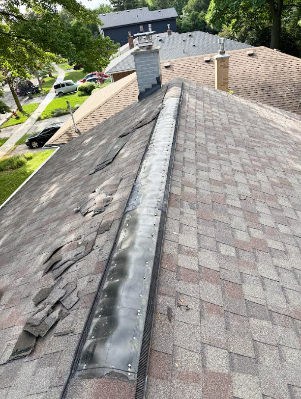 Damaged asphalt shingles requiring professional roof leak repair in Markham.