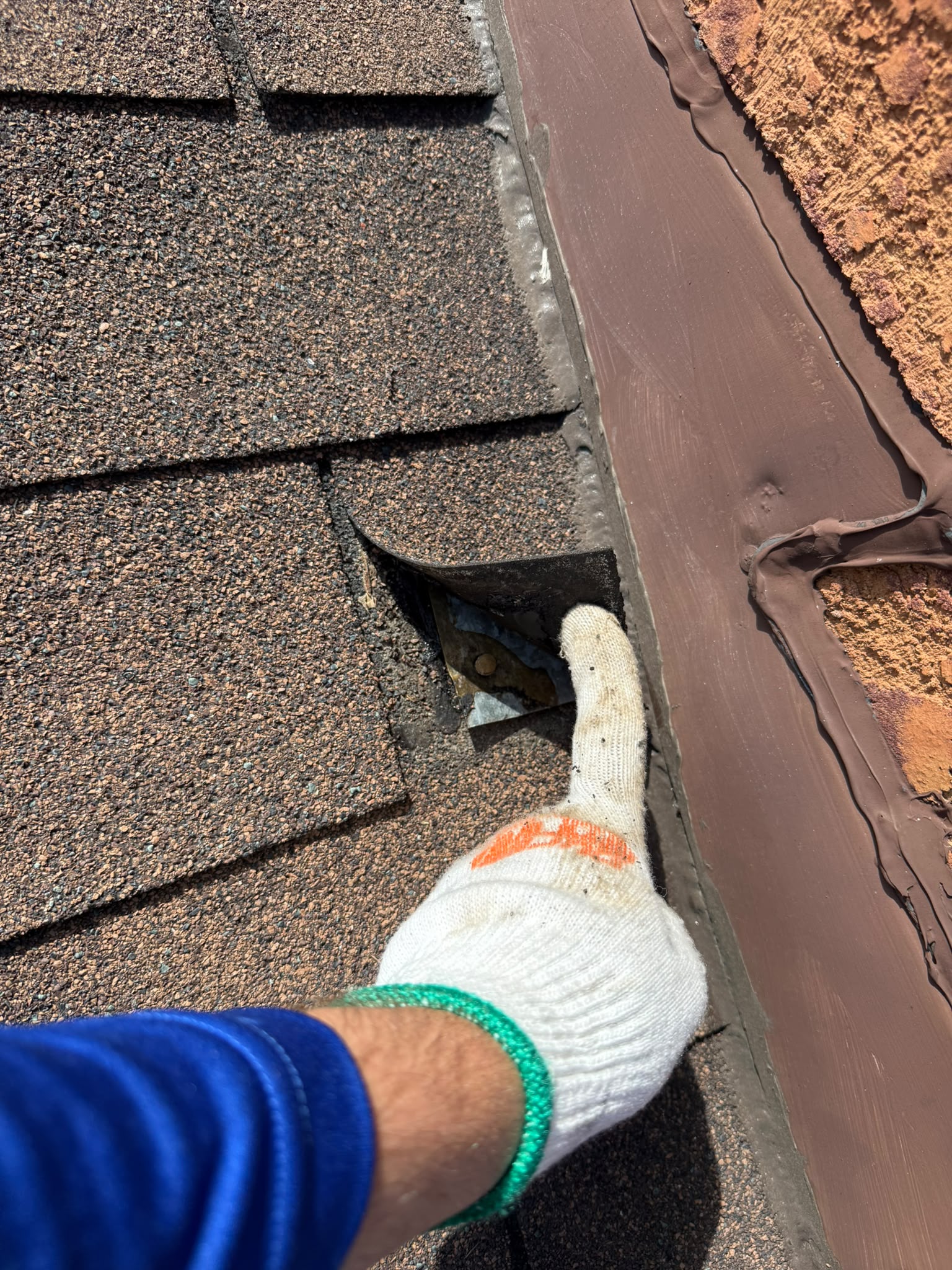 Roof leak inspection near damaged shingles and flashing in Toronto