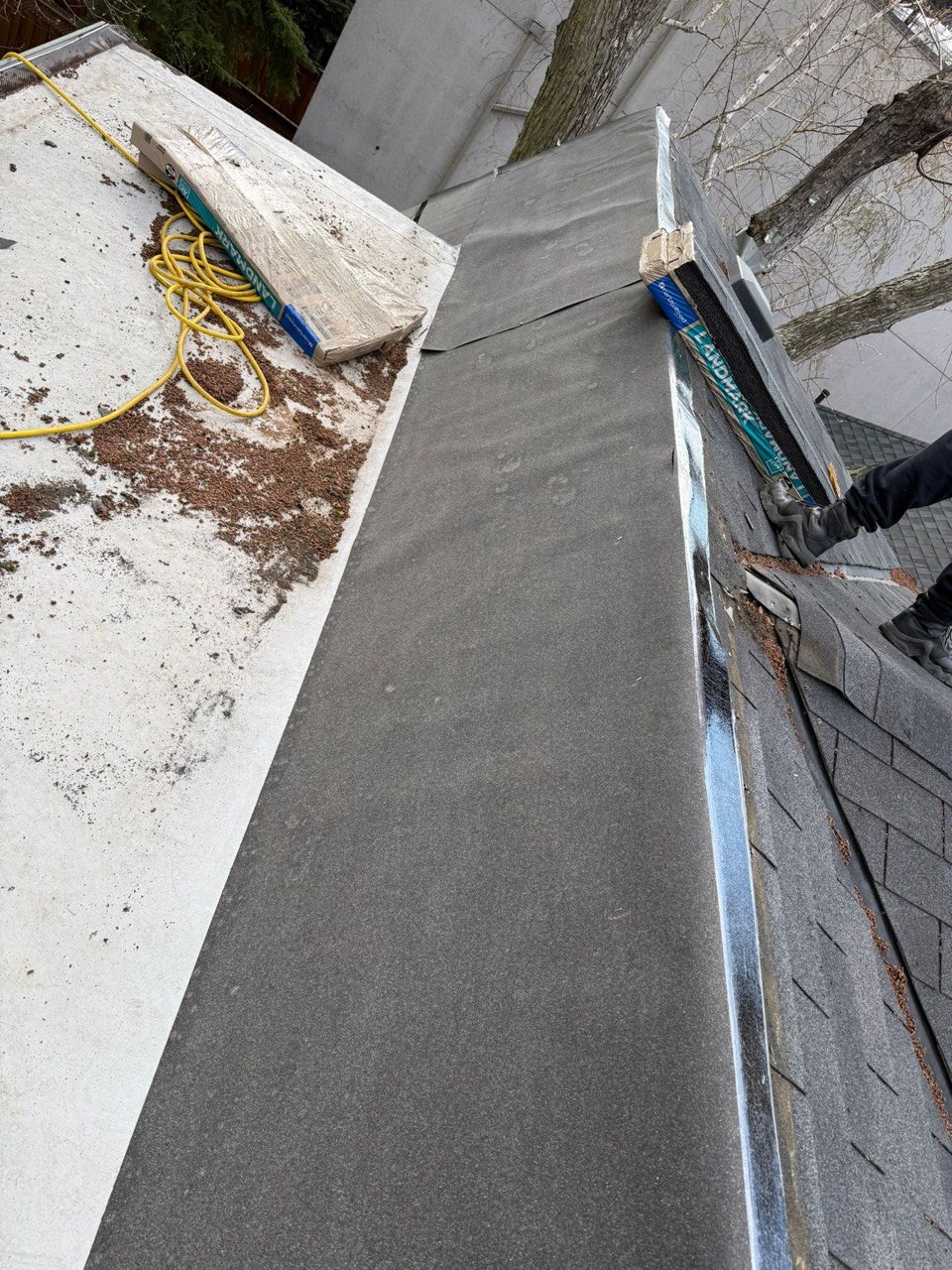 Roof repair in progress with new underlayment and shingles in Thornhill