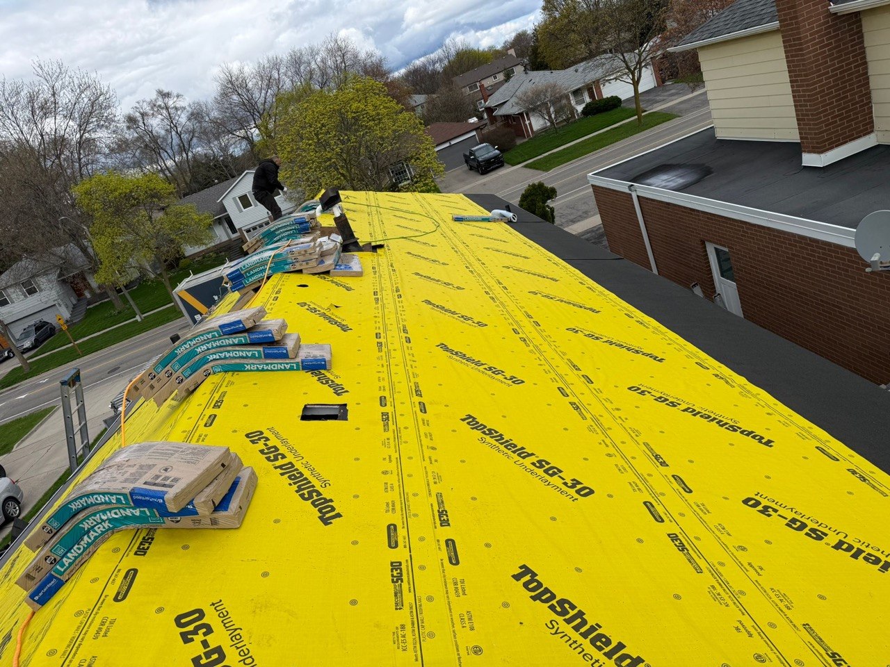 Roof underlayment installation during a residential roofing project in Thornhill