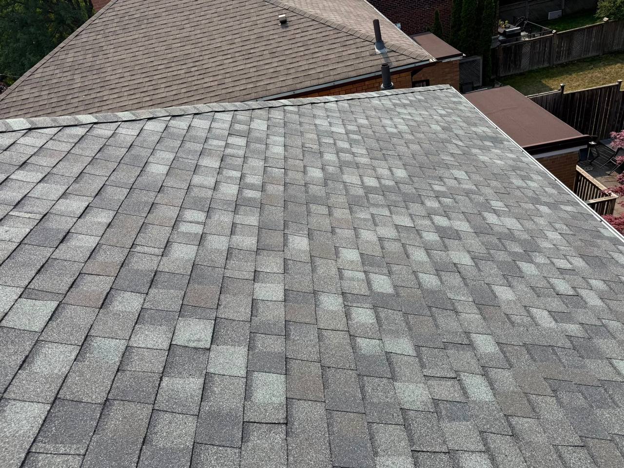 Grey architectural asphalt shingles covering a sloped residential roof